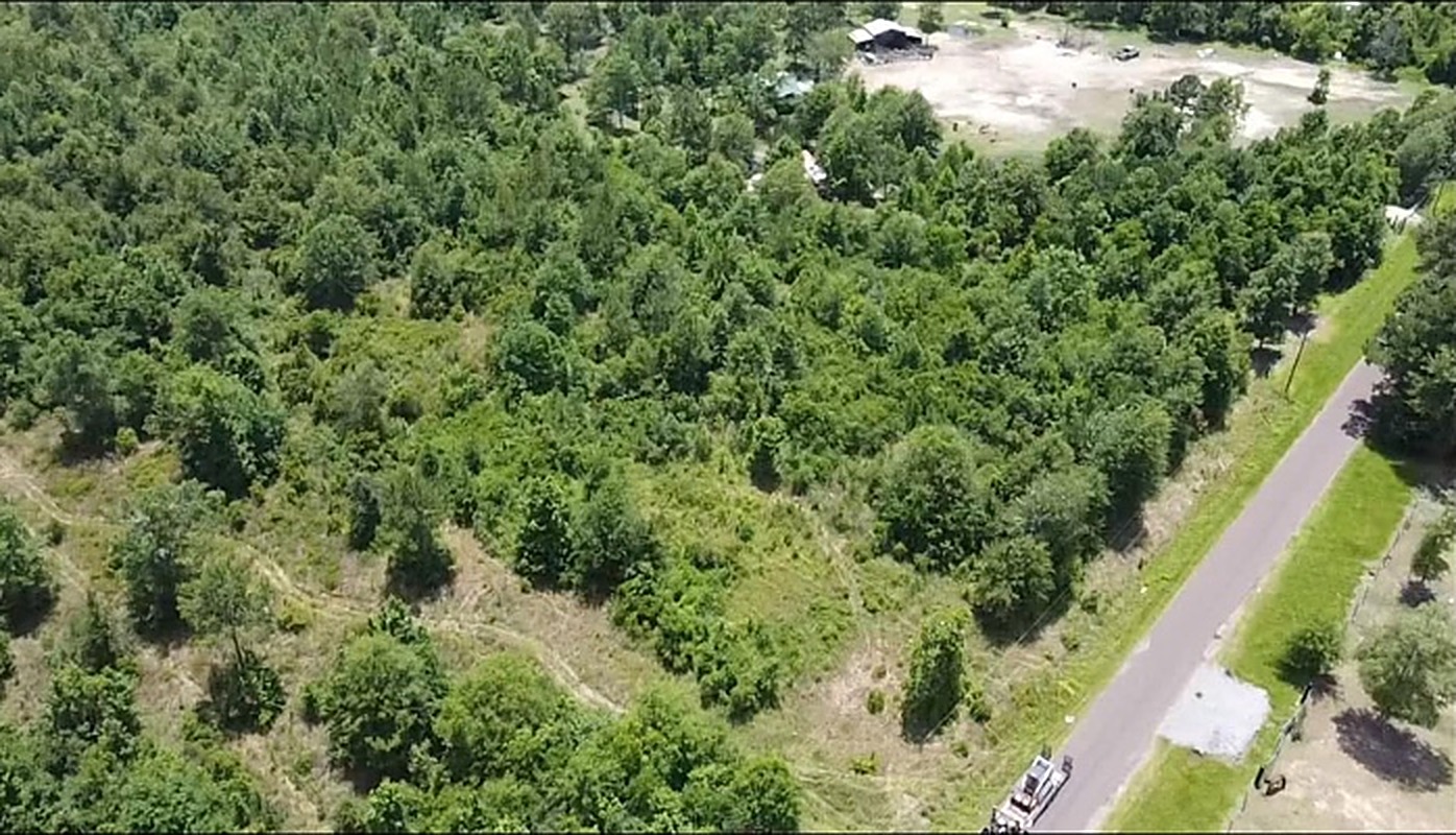 Aerial drone view of a large mulched clearing surrounded by timber in Southeast Texas